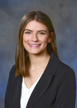 woman with shoulder length brown hair smiling