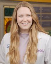 woman with long blonde hair smiling