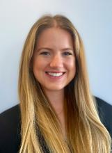 woman with long blonde hair smiling