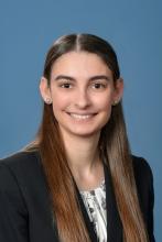 woman with long brown hair smiling