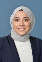 woman with head covering on smling