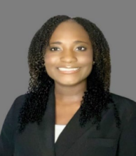 woman with curly shoulder length hair smiling