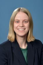 woman with short blonde hair smiling