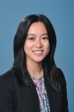 woman with dark hair smiling