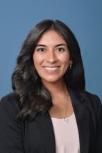 woman with medium length dark hair smiling