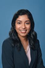 woman with dark hair smiling