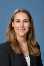 woman with medium length blonde hair smiling