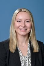 woman with light blonde hair smliing