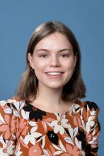 woman with short brown hair smiling