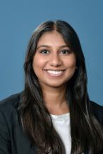 woman with long dark hair smiling