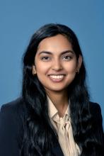 woman with long dark hair smiling