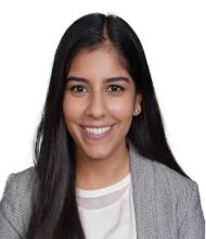 woman with long straight dark hair smiling