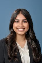 woman with long dark brown hair smiling