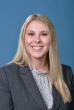 woman with straight blonde hair smiling