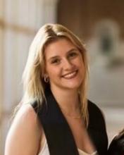 woman with long straight blonde hair smiling