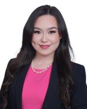 woman with a hot pink top on smiling