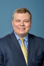 man with blonde hair smiling