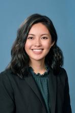 woman with short black hair smiling