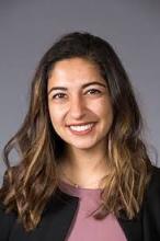 woman with blonde ombre on dark hair smiling