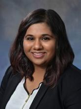 woman with shoulder length dark hair smiling