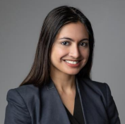 woman with long dark hair smiling