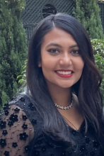 woman with long dark hair smiling