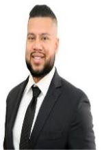 Man smiling in front of white background