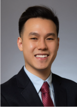 Male smiling wearing suit and tie 