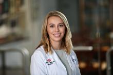 woman with shoulder length straight blonde hair smiling