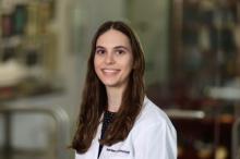woman with long brown hair smiling