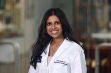 woman with long dark hair smiling