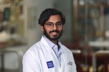 man with glasses smiling