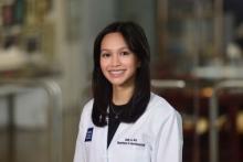 woman with long dark hair smiling