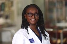 woman with glasses smiling