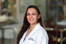 woman with long dark hair smiling