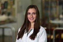 woman with long brown hair smiling
