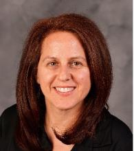 woman with red hair smiling