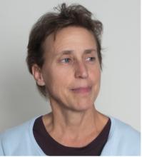 woman with short hair looking to the side