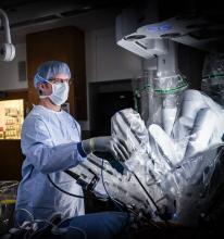 Shawn Groth, M.D. with surgical robot.