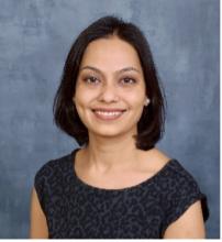 woman with short dark hair smiling