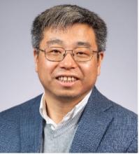 man with glasses smiling