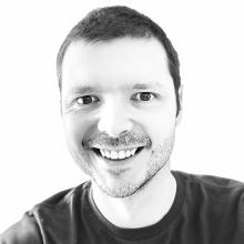 black and white photo of man smiling