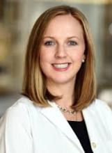 woman with shoulder length hair smiling