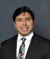 man in a suit smiling