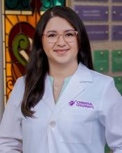 woman with long hair and glasses on smiling