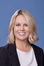 woman with short blonde hair smiling