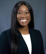woman with long dark hair smiling
