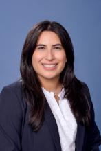 woman with long dark hair smiling