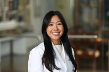 woman with long dark hair smiling