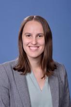 woman with shoulder length brown hair smiling